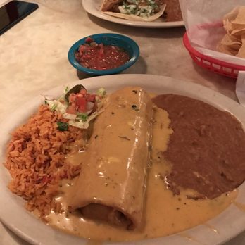 Chuy's - Chuychanga covered in queso with rice and beans!!! Perfection!!! - Tex-Mex Near Me - Plano, Texas Chuy's - Chuychanga covered in queso with rice and beans!!! Perfection!!! - Tex-Mex Near Me - Plano, Texas