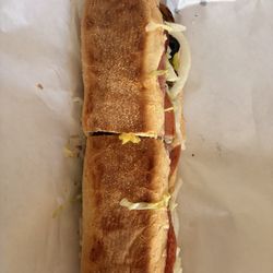 Italian grinder with onion, green pepper, pickles, olives, lettuce, oil vinegar