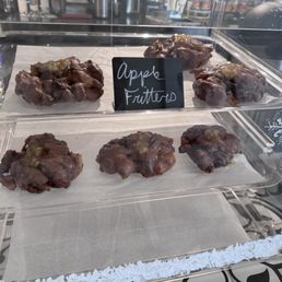 a variety of chocolate covered doughnuts a variety of chocolate covered doughnuts