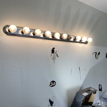 TLM Construction - a bathroom with a light fixture - Electricians Near Me TLM Construction - a bathroom with a light fixture - Electricians Near Me