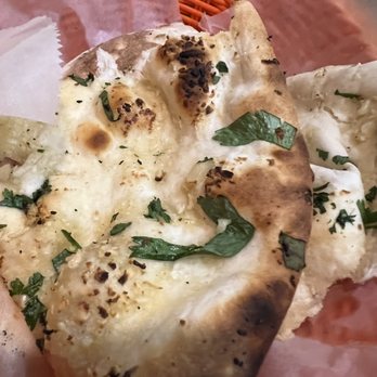 Saffron - Garlic Naan is perfectly prepared and seasoned exactly the way it should be. - Indian Near Me - Waco, Texas