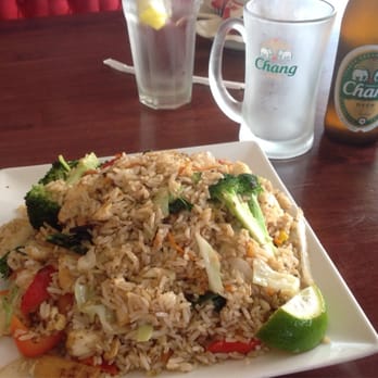 Yum Yum Thai - Basil fried rice with Chang beer (a lager). - Thai Near Me - Naperville, Illinois Yum Yum Thai - Basil fried rice with Chang beer (a lager). - Thai Near Me - Naperville, Illinois