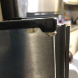 Best Buy - Best Buy service men left our refrigerator door after they changed door opening.