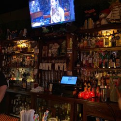 The Merryweather - Bly Manor playing behind the bar