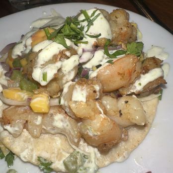 Plank Craft Kitchen & Bar - The shrimp tacos! Three small tacos and they fill them up, so it is very messy, everything falls out. However, they taste amazing! - American Near Me - Folsom, California Plank Craft Kitchen & Bar - The shrimp tacos! Three small tacos and they fill them up, so it is very messy, everything falls out. However, they taste amazing! - American Near Me - Folsom, California