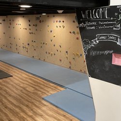 Underground hallway and entrance to Climb's bouldering gym.