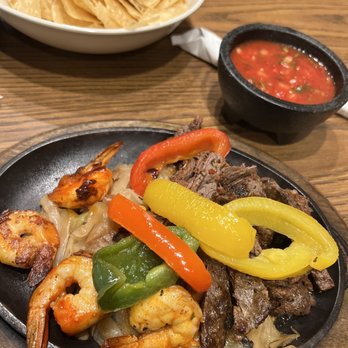 Los Molcajetes - Beef and shrimp with onions and peppers. - Mexican Near Me - Fort Worth, Texas Los Molcajetes - Beef and shrimp with onions and peppers. - Mexican Near Me - Fort Worth, Texas