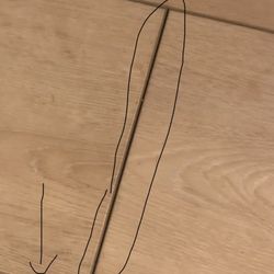 Grizzly's Discount Flooring - One sample of the separation. It should look like the side edge at the arrow. Sticks up.