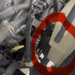 Express Oil Change & Tire Engineers - Empty engine coolant reservoir.
