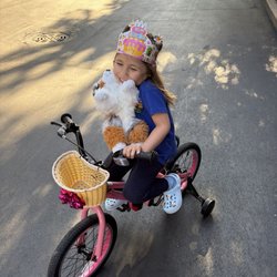 Irv's Bike Shop - Girls bicycle with training wheels and basket. Great find!
