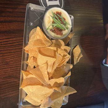 Puttshack - St. Louis - Queso dip with chilli and tortilla chips - Mini Golf Near Me - St. Louis, Missouri