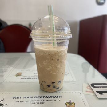 Pho Vietnam - a drink in a plastic cup on a table - Vietnamese Near Me - Seattle, Washington