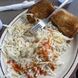 Chatterbox Cafe - Hashbrowns were undercooked/unsalted. I added hot sauce to try and recover the dish.