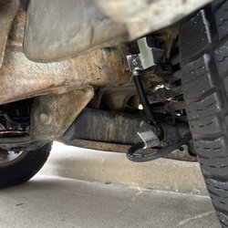 Mavis Tires & Brakes - Brake line brackets zipped tied to control arms.