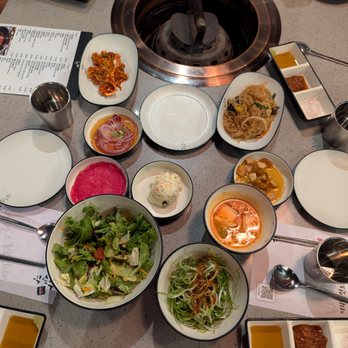 Kang's Kitchen BBQ Duluth - Banchan: japchae, jangajji (soy sauce pickles), mul kimchi, scallion / reg / potato salad, ssam mu radish (beet), marinated onion, kimchi. - Korean Near Me - Duluth, Georgia Kang's Kitchen BBQ Duluth - Banchan: japchae, jangajji (soy sauce pickles), mul kimchi, scallion / reg / potato salad, ssam mu radish (beet), marinated onion, kimchi. - Korean Near Me - Duluth, Georgia