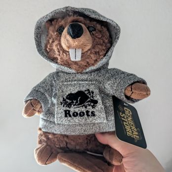 Roots - Promenade - Beaver plushie with a hoodie - Leather Goods Near Me - Thornhill, Ontario
