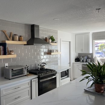 Los Pinos Cabinets - a kitchen with white cabinets - Cabinetry Near Me