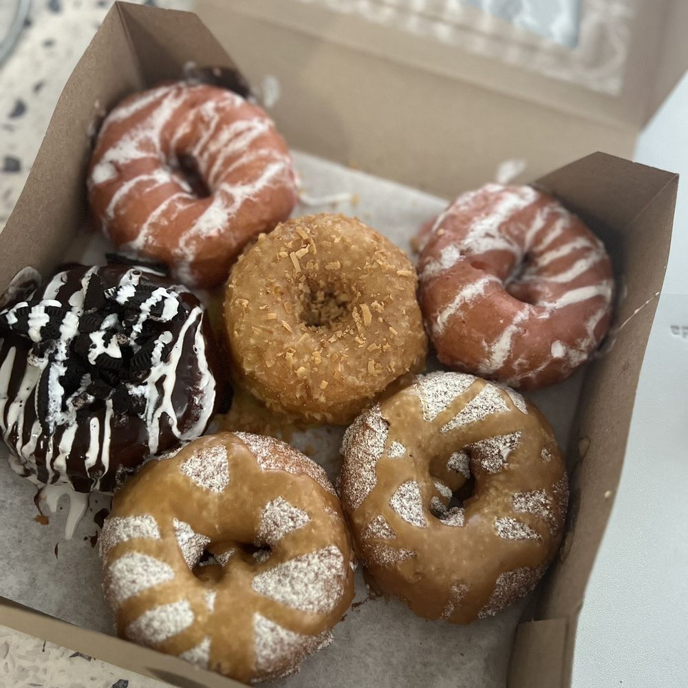 Craving Donuts - Strawberry (top left & right). Lemon/coconut (top middle). Cookies & cream (bottom left). Funnel cake w/ caramel (bottom right). - Food Trucks Near Me Craving Donuts - Strawberry (top left & right). Lemon/coconut (top middle). Cookies & cream (bottom left). Funnel cake w/ caramel (bottom right). - Food Trucks Near Me