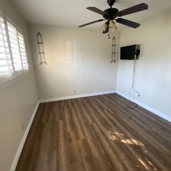 Carreras Carpet & Blinds - a room with a ceiling fan - Carpet Installation Near Me - Bellflower, California Carreras Carpet & Blinds - a room with a ceiling fan - Carpet Installation Near Me - Bellflower, California