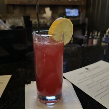 The Glass House - a drink with a slice of lemon - Gastropubs Near Me - Lynchburg, Virginia