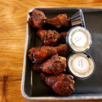 District Brew Yards - a tray of chicken wings and dipping sauces - Brewpubs Near Me - Wheeling, Illinois