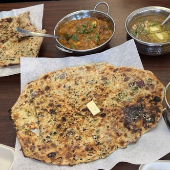 Indian Village - Amritsari kulcha with choley, kadhai paneer, and dal makhani. - Vegetarian Near Me - Bakersfield, California Indian Village - Amritsari kulcha with choley, kadhai paneer, and dal makhani. - Vegetarian Near Me - Bakersfield, California