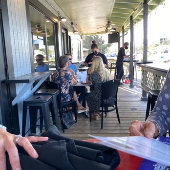 Slicker's Eatery - Outdoor dining on the porch. - Cocktail Bars Near Me - Bradenton, Florida