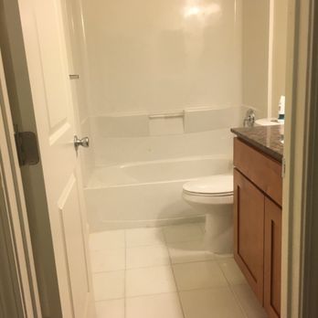 Mary's Cleaning  -  bathroom with a toilet and bathtub - Home Cleaning Near Me
