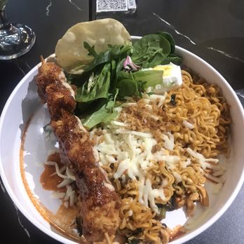 The Cream - It's the K-fired chicken with spicy noodles and a egg and a chip with cheese i think and lettuce - Korean Near Me - Duluth, Georgia The Cream - It's the K-fired chicken with spicy noodles and a egg and a chip with cheese i think and lettuce - Korean Near Me - Duluth, Georgia