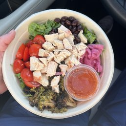 a person holding a bowl of food