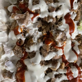 Osmow's Shawarma - a pizza covered in sauce - Mediterranean Near Me - Peterborough, Ontario Osmow's Shawarma - a pizza covered in sauce - Mediterranean Near Me - Peterborough, Ontario