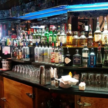 The Sherlock Holmes Pub - a man standing at the bar - Pubs Near Me - Edmonton, Alberta