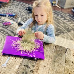 Garden Montessori School - Separating burlap for birds to take to make nests