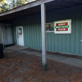 Lighthouse Bar and Grill - Other entrance. Hunt Brothers Pizza signage is more prominent than actual bar name - Bars Near Me - Karnack, Texas