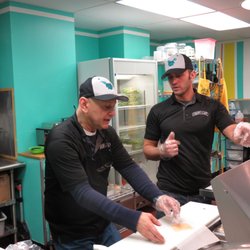 Crespo Cafe - Macho and Al strategizing to make the perfect sandwich.