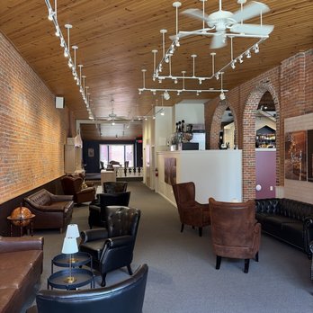 Pop The Cork - Large seating area below wine bar platform. - Wine Bars Near Me - Moline, Illinois