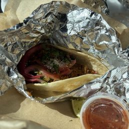 Street beef taco with onions, cilantro & cheese. Street beef taco with onions, cilantro & cheese.