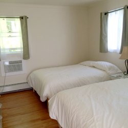 Birchwood Lodge and Farmette - Cute, clean, simply appointed cottage offers two full size beds in the alcove bedroom.