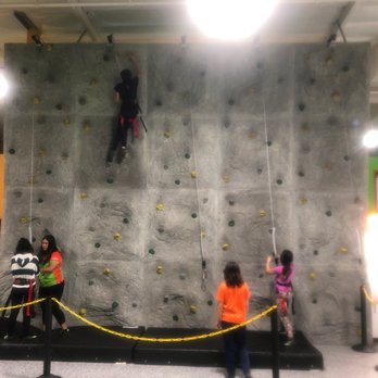 Sky Zone Trampoline Park - Kids having fun on the rock climb wall! - Trampoline Parks Near Me - Vacaville, California