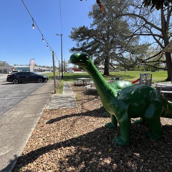 Water's Edge Chocolates - Lovely sauropods outside hehe - Chocolatiers & Shops Near Me - Tullahoma, Tennessee