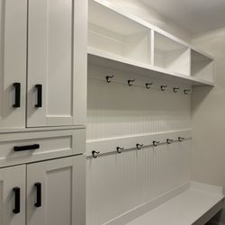 T. C. B. Residential Services - Beadboard paneling and built-in shelves, merged with a cabinet.