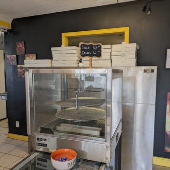 NY Pizza - a display of pizzas in a restaurant - Pizza Near Me - Ottawa, Ontario NY Pizza - a display of pizzas in a restaurant - Pizza Near Me - Ottawa, Ontario