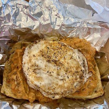 Los Toasties - RED CHILE SAUSAGE GRAVY SMOTHERD OVER A GREEN CHILE BISCUIT BY SUNSET COMIDA WITH FRIED EGG - Delis Near Me - Albuquerque, New Mexico Los Toasties - RED CHILE SAUSAGE GRAVY SMOTHERD OVER A GREEN CHILE BISCUIT BY SUNSET COMIDA WITH FRIED EGG - Delis Near Me - Albuquerque, New Mexico