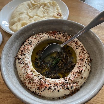 Zhug - Nigella seed and burnt onion hummus - Mediterranean Near Me - Cleveland Heights, Ohio Zhug - Nigella seed and burnt onion hummus - Mediterranean Near Me - Cleveland Heights, Ohio