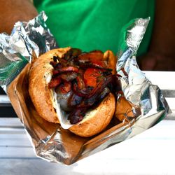 Truck’N Delicious - Sausage sandwich with peppers and onions with provolone on garlic bread roll.