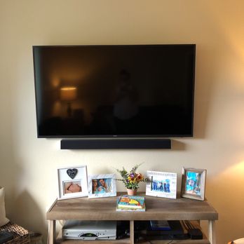 Island Hometech - a flat screen tv mounted on a wall - Home Theatre Installation Near Me - Murrieta, California Island Hometech - a flat screen tv mounted on a wall - Home Theatre Installation Near Me - Murrieta, California