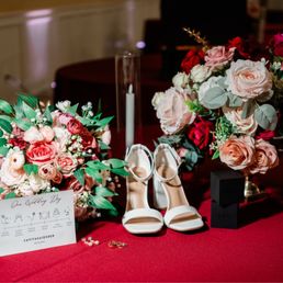 CL decor's floral centerpiece is the one on the right along with the candles CL decor's floral centerpiece is the one on the right along with the candles