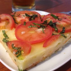 Sabores Patagónicos - Pizza de queso, tomate y perejil.