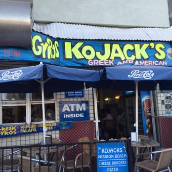 Kojack's - Front patio seating with cool breezes and people walking to the beach. - Greek Near Me - San Diego, California