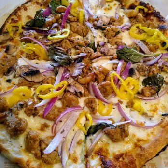 Blaze Pizza - White cream sauce, sausage, onion, roasted whole garlic, banana peppers, and fresh basil - Salad Near Me - Durham, North Carolina